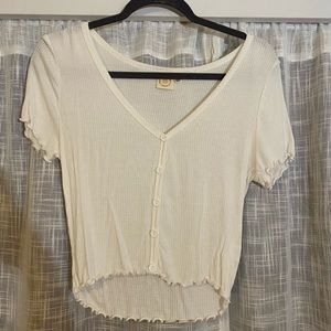 White button up shirt with frilly edges